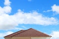 Brick roof with clear cloud blue sky Royalty Free Stock Photo