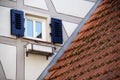 Brick roof next to truss facade