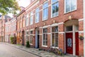 Brick row houses along a cobbled street in a historic district Royalty Free Stock Photo