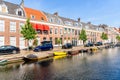 Brick row houses alongside a canal on clear summer day Royalty Free Stock Photo