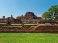 Brick ruins of the ancient city with lawn