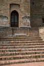 Brick staircase that leads to a door in a brick wall Royalty Free Stock Photo