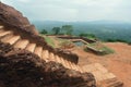 Brick stairs of historical city Sigiriya, ancient landscape, water pool and trees, Sri Lanka. UNESCO world heritage site