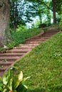 Brick steps leading up a hill in a garden. Royalty Free Stock Photo