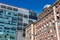 A 1927 brick and stone building is juxtaposed against a 2010 glass and steel structure on the Columbia University campus Royalty Free Stock Photo