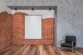 Brick and stone living room, armchair and poster Royalty Free Stock Photo