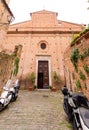 Brick and stone walled small church and street view from the historical Italian city of Siena, Italy Royalty Free Stock Photo