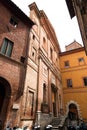 Brick and stone walled small church and street view from the historical Italian city of Siena, Italy Royalty Free Stock Photo