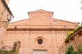 Brick and stone walled small church and street view from the historical Italian city of Siena, Italy Royalty Free Stock Photo