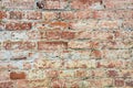 Brick texture close-up. Brick wall made of red bricks. Old masonry. Collapsed wall of a house