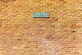 Brick texture of typical english building with warning plate playing of ball games is prohibited in this area, uk Royalty Free Stock Photo