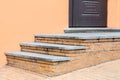 Brick threshold with granite steps to the front door.