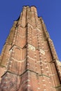 Brick tower of Saint Michel church against blue sky, Ravels, Flanders, Belgium