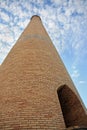 Brick tower scraping sky