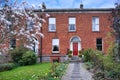 Brick townhouse with spring flowers Royalty Free Stock Photo