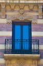 Brick traditional window and balcony in Spain with stucco decoration Royalty Free Stock Photo