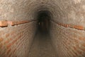 Brick tunnel of a secret underground passage Royalty Free Stock Photo