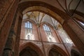 Brick vault with windows, arches and pillars inside the St. Georgen Church in the old town of Wismar, famous tourist attraction Royalty Free Stock Photo