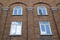 Brick wall arch windows building facade old architecture Royalty Free Stock Photo