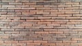 Brick wall background is a wall made of clay bricks, giving the structure strength and cement line between bricks that looks Royalty Free Stock Photo