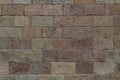 Brick wall background. Old brickwork with multicolor bricks in tints of pink, yellow, green