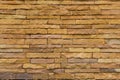 Brick wall background is a wall made of clay bricks, giving the structure strength and cement line between bricks that looks Royalty Free Stock Photo