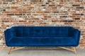 Brick wall and blue sofa