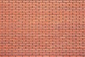 Brick wall of bright orange color. Texture, background Royalty Free Stock Photo