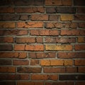 A brick wall composed of rectangular, reddish-brown bricks with visible texture and Royalty Free Stock Photo