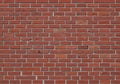 Brick wall composed of uniform, rectangular bricks arranged in a Royalty Free Stock Photo