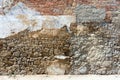 Brick wall concrete plaster for background. Colors ocher, white, grey and red. Wall texture. damaged to wall. Royalty Free Stock Photo