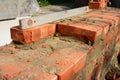 Brick Wall Construction Process with Level Tool Royalty Free Stock Photo