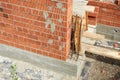 Brick wall construction in progress at a building site during daylight hours Royalty Free Stock Photo