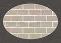 Brick wall in dark gray oval frame with scratched texture, grunge, brickwork of ordinary grey bricks. Royalty Free Stock Photo