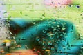 Brick wall decorated with spring summer shades of colors. Detail of a graffiti Royalty Free Stock Photo