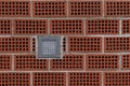 Brick wall with decorative ventilation blocks and a light fixture Royalty Free Stock Photo