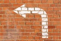 Brick wall with direction sign Royalty Free Stock Photo