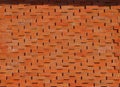 Brick wall with an alternating oblique pattern. Background and texture