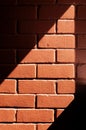 Brick wall fiery red background with light spot Royalty Free Stock Photo
