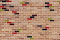 Brick wall with glazed coloured bricks.