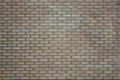 Brick wall of gray and yellow bricks. rough surface texture Royalty Free Stock Photo