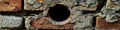 A brick wall with a hole, suitable for use as a background or property boundary image Royalty Free Stock Photo