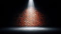 Brick wall illuminated by a spotlight in a dark room Royalty Free Stock Photo