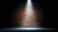 Brick wall illuminated by a spotlight in a dark room Royalty Free Stock Photo