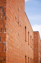 Brick wall of modern building in perspective. Royalty Free Stock Photo