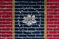 Brick wall with the new flag of the US state of Mississippi Royalty Free Stock Photo