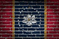 Brick wall with the new flag of the US state of Mississippi Royalty Free Stock Photo