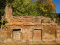Brick wall of an old collapsed building. Ruins on a sunny day Royalty Free Stock Photo