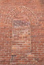 Brick wall with old Gothic church window closed off with vintage brick, religious freedom concept Royalty Free Stock Photo