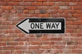 Brick Wall with One Way Sign Royalty Free Stock Photo